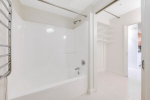 Interior Unit Bathroom, shower/bathtub, white walls, tile floor.